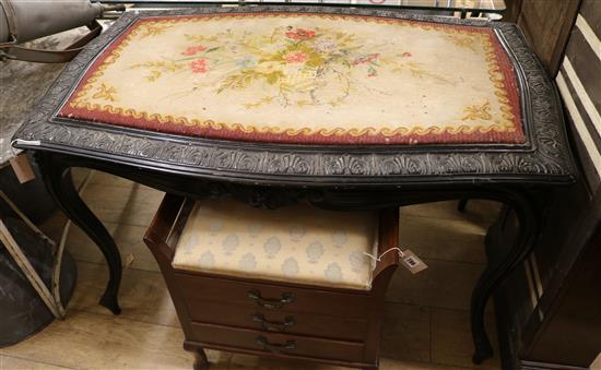 A 19th century French black painted centre table, with tapestry top W.120cm